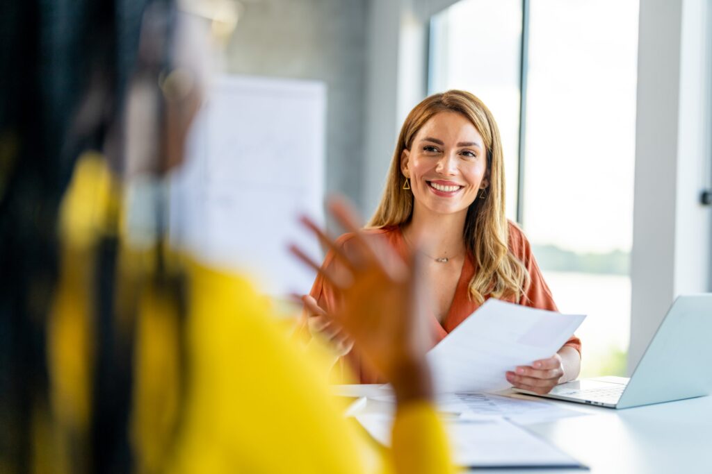 An intern working with a colleague that they are job shadowing