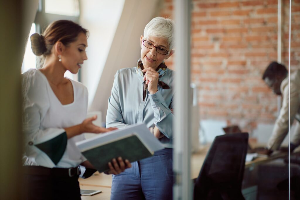 A senior manager discussing a project with a direct report